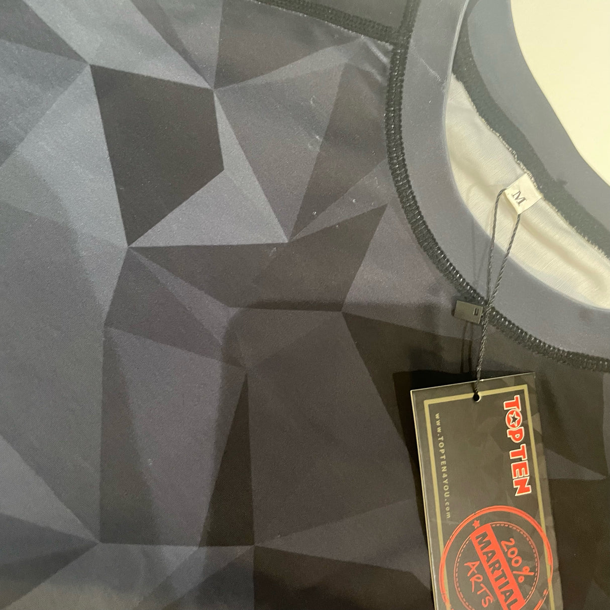 POŠKOZENÉ: Rashguard Top Ten Prism, 14151-9